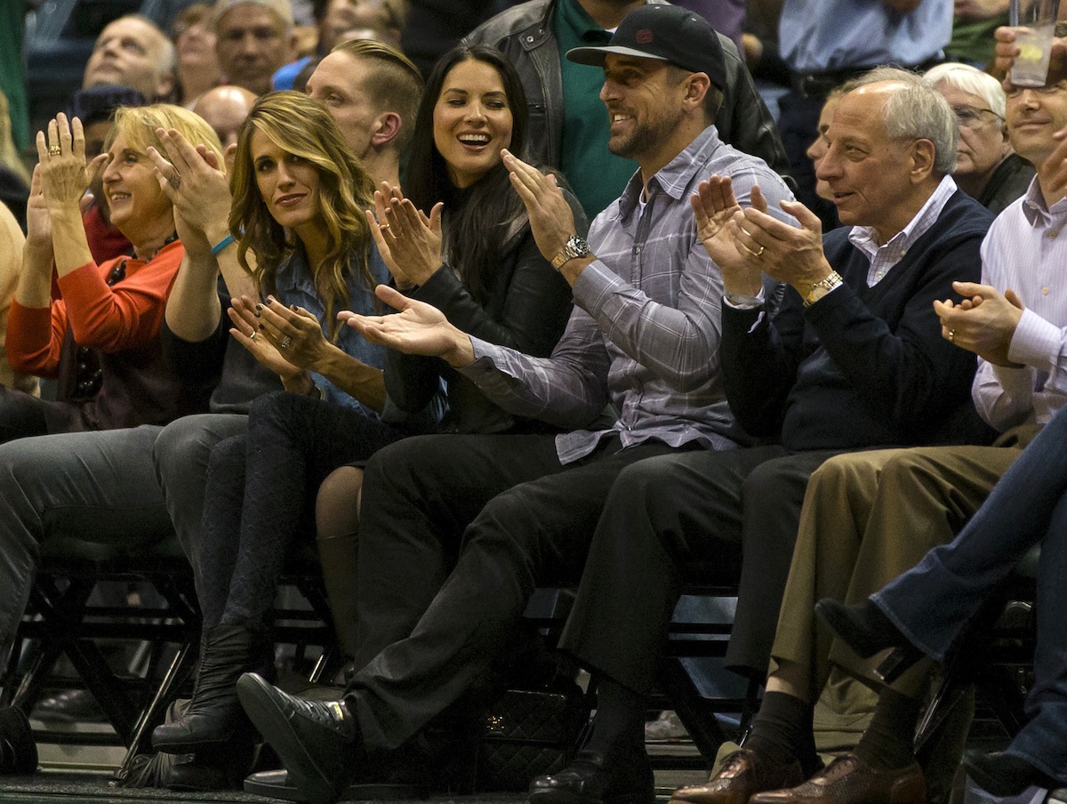 A.J. Hawk, Laura Quinn-Hawk, Oivia Munn and Aaron Rodgers by Jeff Hanisch—USA TODAY Sports.