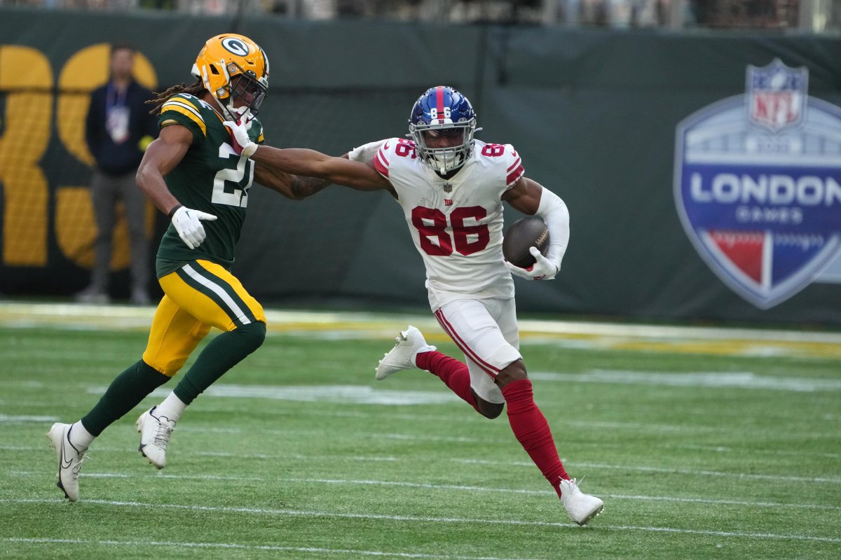 Giants' WR Darius Slayton evades a tackler in the 27-22 win over the Packers.